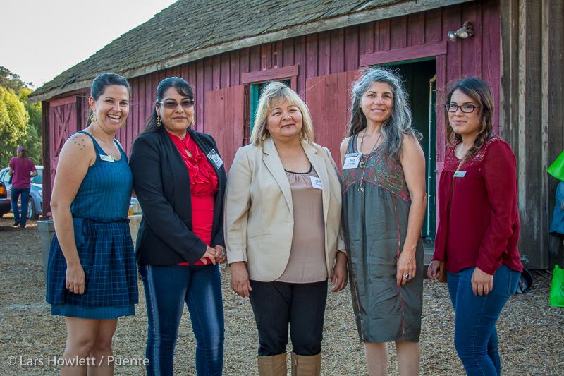 Yesenia, second from left, with the other promotoras at Puente's Fall Harvest Celebration.
